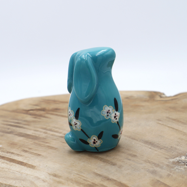 Lapin en céramique turquoise avec des fleurs Victoria Céramique